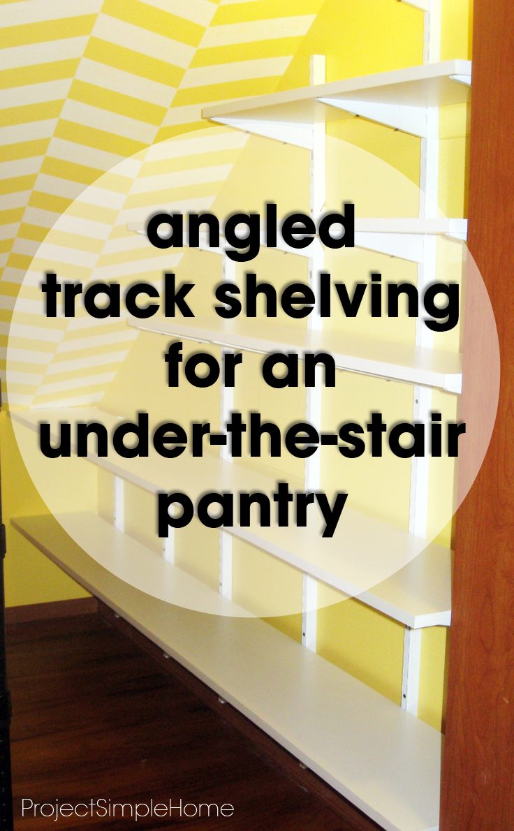 Angled white track shelving fitted beneath a stair